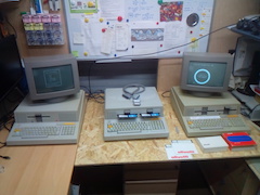 Three different Olivetti M20 models. From left to right, an UK-spec M20-D model, with a 640 KiB disk drive, a Spanish model (not working) and an UK-spec ST model.